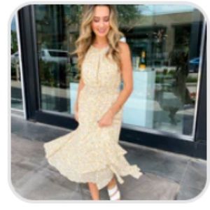 Floral Dress from Flourish & Frills Boutique. Opening in front of dress